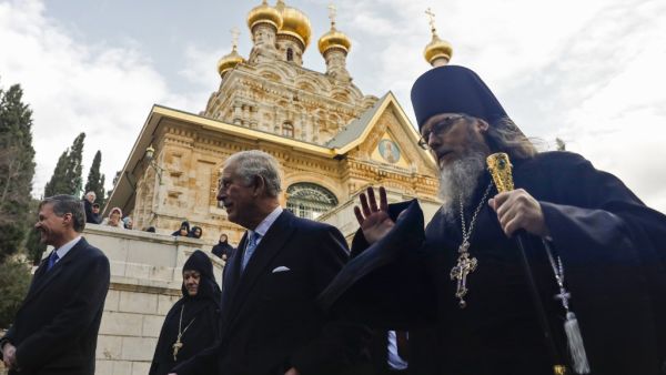 Britain's Charles (R), Prince of Wales, walks with Roman Krassovsky, Archimandrite of the Russian Orthodox Church Outside Russia (ROCOR) and chief of its Russian Ecclesiastical Mission in Jerusalem, as the former visits the Russian Orthodox Church of Mary Magdalene on the Mount of Olives in Jerusalem on January 24, 2020. Ahmad GHARABLI / AFP