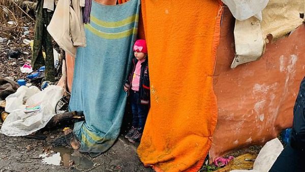 The rubbish tip where the girl was living. Valentina Kartasheva, who works at the orphanage said: 'We did not want to give her to him, we had a feeling. But we had to obey the law'. (CEN)
