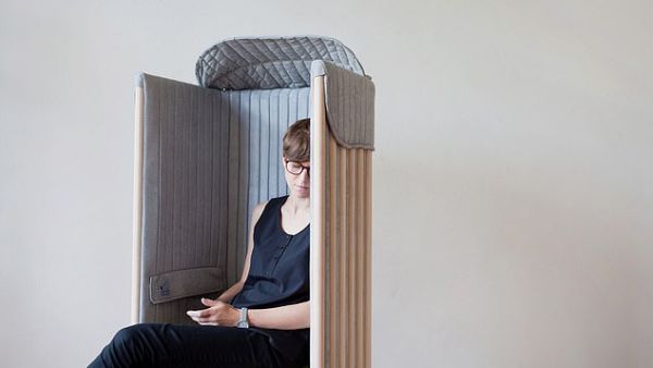 Upholstered in a soft, grey covering fabric, the chair provides a 'cosy, intimate, comfy and silent' space to isolate its occupants from the surrounding environment.