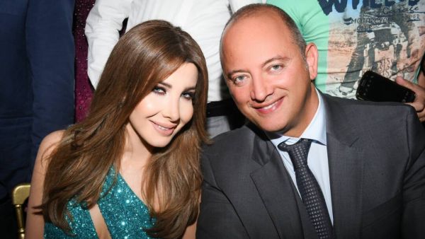 At this point, Ajram's husband goes to collect the money