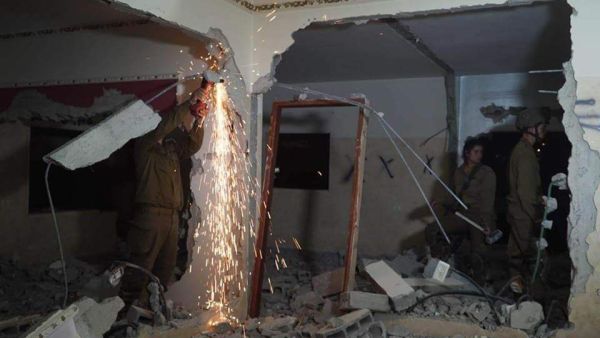 Demolishing two Palestinian homes (Twitter)