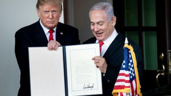 Trump hosted Netanyahu at the White House in March 2019, signing a proclamation recognising the annexed Golan Heights as Israel sovereign territory (AFP Photo/Brendan Smialowski)