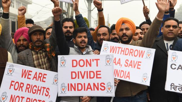 Activists of the Youth Congress hold placards and shout slogans during a protest against India's new citizenship law in Amritsar on December 24, 2019 AFP