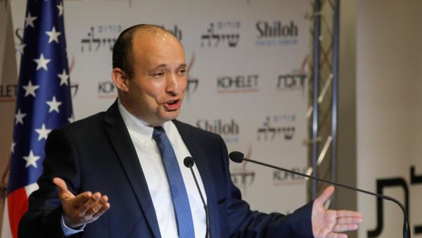 Naftali Bennett, Israel's defence minister, speaks at the Kohelet Policy Forum conference in Jerusalem, 8 January (AFP)