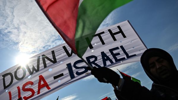 Demonstrators wave Turkish and Palestinian flags during a rally at Yenikapı Square, in Istanbul, to protest against the US-made peace plan, also known as the ‘Agreement of the Century’ Ozan KOSE / AFP