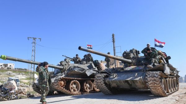 Syrian army units advance in the town of al-Eis in south Aleppo province on February 9, 2020, following battles with rebels and jihadists. Al-Eis, which overlooks the M5, was on a front that saw fierce fighting between the regime and its opponents in 2016. Syrian troops advancing north of Idlib linked up near Al-Eis with their comrades pushing south of Aleppo, state news agency SANA said. The two units had recently waged separate battles in rural Aleppo and southern Idlib, but are now conjoined for the firs