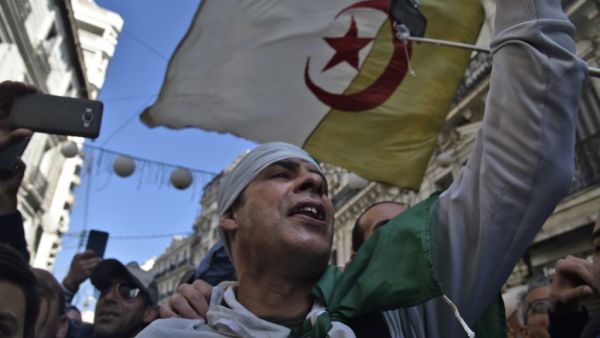 Algerians chant slogans as they march in an anti-government demonstration in the capital Algiers on February 14, 2020. RYAD KRAMDI / AFP