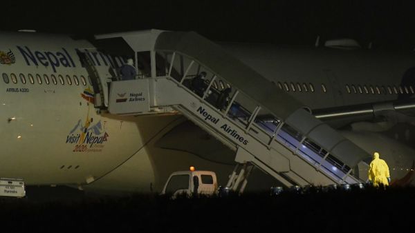 Nepali students who were repatriated from Wuhan, China amid the novel coronavirus COVID-19 outbreak, arrive at the Tribhuvan International Airport in Kathmandu on February 16, 2020. PRAKASH MATHEMA / AFP