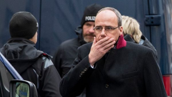 Hesse state Interior Minister Peter Beuth reacts as he arrives at one of the bar target in a shooting at the Heumarkt in the centre of Hanau, near Frankfurt am Main, western Germany, on February 20, 2020, where at least nine people were killed in two shootings late on February 19, 2020. The suspect in two shootings in Germany that killed at least nine people was found dead at home, police said on February 20, 2020. At least nine people were killed in two shootings late on February 19 in Hanau, near the Germ