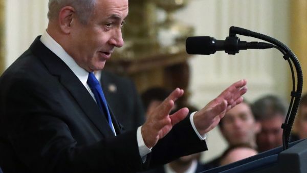 WASHINGTON, DC - JANUARY 28: Israeli Prime Minister Benjamin Netanyahu speaks during a press conference with U.S. President Donald Trump in the East Room of the White House on January 28, 2020 in Washington, DC. President Trump is expected to release details of his administration's long-awaited Middle East peace plan to resolve the Israeli-Palestinian conflict. Alex Wong/Getty Images/AFP ALEX WONG / GETTY IMAGES NORTH AMERICA / AFP
