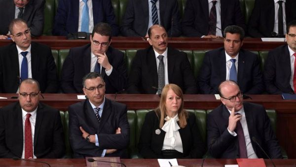 Elyes Fakhfakh, bottom right, has brought parties from across the political spectrum into his Cabinet — and they continue to disagree on several big policy areas. (AFP)
