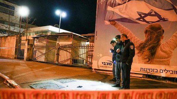 Israeli policemen inspect the site of a car-ramming attack carried out by a Palestinian in Jerusalem in the early hours of this morning  (AFP)