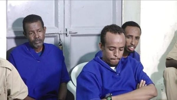 Abdifatah Abdirahman Warsame (pictured centre) and Abdishakur Mohamed Dige were shot by a firing squad in Bossasso town square today after being found guilty of the attack. (Daily Mail)