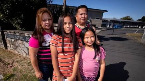 Beth and Ronne and their daughters Joyce, 11, and Jasmine, 7, who were forced out of class over coronavirus fears  (DAILYMAIL)