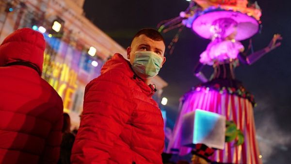 Revellers wear masks to protect themselves from COVID-19 as they attend the Nice carnival in the french riviera city. AFP/File