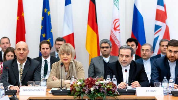 Iranian political deputy at the Ministry of Foreign Affairs of Iran Abbas Araghchi (C-R) and German Secretary General of the European External Action Service Helga Maria Schmid (C-L) attend a meeting of the Joint Commission on Iran's nuclear program. (JOE KLAMAR/AFP/GETTY IMAGES)