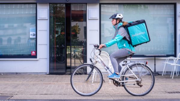 Deliveroo is food delivery company. Couriers transport orders from restaurants to customers. (Shutterstock)