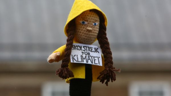A activist holds a doll depicting Swedish climate activist Greta Thunberg during a "Youth Strike 4 Climate" protest march in Bristol, south west England on February 28, 2020. "Activism works, so I ask you to act": young Swedish climate activist Greta Thunberg called on young British people to rally during a climate march on Friday in Bristol. GEOFF CADDICK / AFP