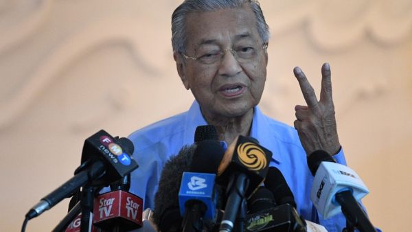 Malaysia's interim Prime Minister Mahathir Mohamad gestures during a press conference in Kuala Lumpur on March 1, 2020, after Muhyiddin Yassin was appointed as Malaysia's next prime minister by the king. Malaysia's political crisis deepened after 94-year-old Mahathir Mohamad rejected a decision by the king to pick his rival Muhyiddin as the next prime minister, insisting he had enough backing to return to the role. Mohd RASFAN / AFP