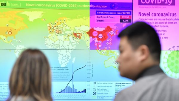 This picture taken on March 2, 2020 shows a display with a graphic updates on the progress of the coronavirus COVID-19 outbreak around the world, during a press conference held at the Emergency Response Coordination Centre in Brussels, on the EU response to COVID-19, on March 2, 2020. The European Union's disease control agency has increased its risk level for the novel coronavirus COVID-19 from moderate to high, EU Commission president Ursula von der Leyen said on March 2, 2020. JOHN THYS / AFP