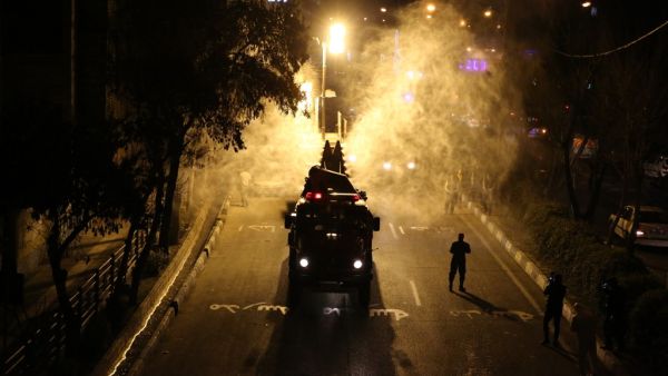 Iranian firefighters disinfect streets and alleys in southern Tehran to halt the wild spread of coronavirus on March 11, 2020. The novel coronavirus outbreak in Iran is one of the deadliest outside of China and has so far killed 291 people and infected more than 8,000.  ATTA KENARE / AFP