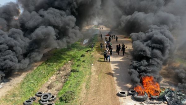 Syrians protest and burn tyres in an attempt to block traffic on the M4 highway, which links the northern Syrian provinces of Aleppo and Latakia, before incoming joint Turkish and Russian military patrols (as per an earlier agreed upon ceasefire deal) in the village of al-Nayrab, about 14 kilometres southeast of the city of Idlib and seven kilometres west of Saraqib in northwestern Syria on March 15, 2020. Russian President Vladimir Putin and his Turkish counterpart Recep Tayyip Erdogan reached a deal on March 5 to create a security corridor with joint Turkish and Russian patrols starting on March 15 along the key M4 highway in northern Syria, which runs roughly parallel to the border with Turkey, from northeastern Kurdish-controlled regions to the Mediterranean coast. Omar HAJ KADOUR / AFP Syrians protest and burn tyres in an attempt to block traffic on the M4 highway, which links the northern Syrian provinces of Aleppo and Latakia, before incoming joint Turkish and Russian military patrols (as per an earlier agreed upon ceasefire deal) in the village of al-Nayrab, about 14 kilometres southeast of the city of Idlib and seven kilometres west of Saraqib in northwestern Syria on March 15, 2020. Russian President Vladimir Putin and his Turkish counterpart Recep Tayyip Erdogan reached a deal on Ma