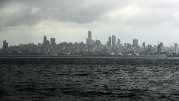 A picture taken from the seaside promenade of the northern Lebanese coastal town of Dbayeh shows the skyline of the Lebanese capital Beirut on March 17, 2020, as the east Mediterranean country deals with an outbreak of the novel coronavirus, the latest crisis to hit a country reeling from a severe economic crunch and mass anti-government protests. Lebanon urged people to stay at home for two weeks and prepared to close its main airport to stem a novel coronavirus outbreak that has killed three people in the