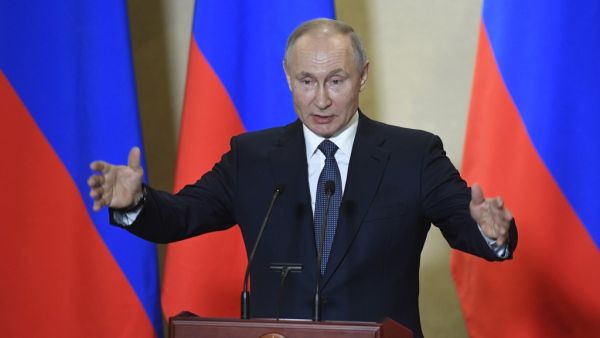 Russian President Vladimir Putin gives a speech during an awards ceremony for those who led the construction of the 19 kilometres (12 miles) road and rail Crimean Bridge over the Kerch Strait - that links mainland Russia to Moscow-annexed Crimea - in Sevastopol, Crimea, on March 18, 2020. Alexander NEMENOV / AFP / POOL