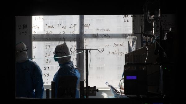 Medical information is seen on a window in a ward treating COVID-19 coronavirus patients at a hospital in Wuhan, in China's central Hubei province on March 19, 2020. China on March 19 reported no new domestic cases of the coronavirus for the first time since it started recording them in January, but recorded a spike in infections from abroad. STR / AFP