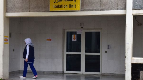 A medical worker walks past the coronavirus isolation section at Rafiq Hariri University Hospital in Beirut on March 20, 2020 where coronavirus COVID-19 patients are being treated. AFP