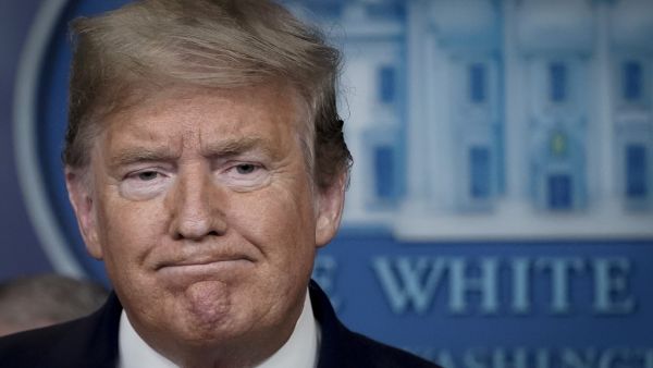 U.S. President Donald Trump pauses while speaking during a briefing on the coronavirus pandemic, in the press briefing room of the White House on March 24, 2020 in Washington, DC. Cases of COVID-19 continue to rise in the United States, with New York's case count doubling every three days according to Governor Andrew Cuomo. Drew Angerer/Getty Images/AFP Drew Angerer / GETTY IMAGES NORTH AMERICA / Getty Images via AFP