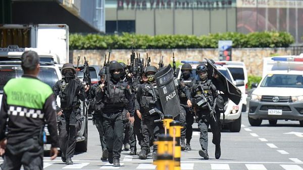The ex-guard shot a fellow guard, who is now in hospital in stable condition, and has taken 30 people including mall vendors hostage inside the building. (AFP/File)