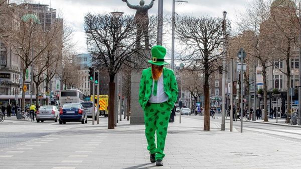 St Patrick's Day 2020 in Dublin: A man celebrating St Patrick's Day strolls in the O'Connell Street area of Dublin today as St Patrick's Day festivities are cancelled (AFP)