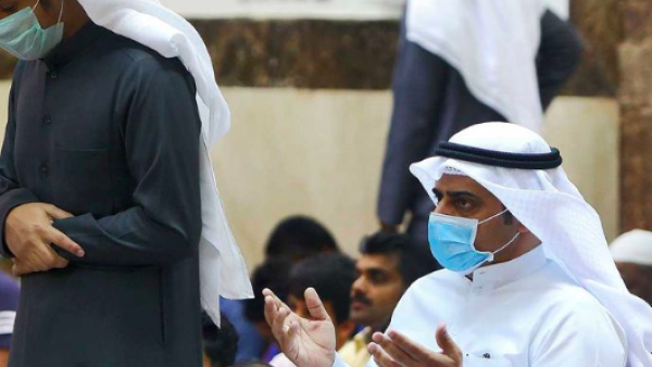 Worshippers wearing protective masks perform at a mosque in Kuwait City on February 28, 2020. (AFP)