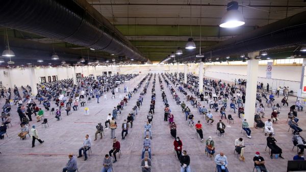 Expatriate returning from Egypt, Syria, and Lebanon arrive to be re-tested at a Kuwaiti health ministry containment and screening zone for COVID-19 coronavirus disease in Kuwait City on March 16, 2020. Facing a mounting public health threat, Saudi Arabia, the United Arab Emirates, Kuwait, Bahrain, Qatar and Oman have taken drastic measures to combat the pandemic. Kuwait has taken the strictest measures in the GCC by largely locking down the country over the weekend. YASSER AL-ZAYYAT / AFP