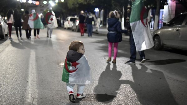 In this file photo taken on April 2, 2019, Algerians celebrate in the capital Algiers after the country's veteran President Abdelaziz Bouteflika informed the Constitutional Council that he was resigning. A year after the unexpected downfall of Algeria's longtime president Abdelaziz Bouteflika, the ailing octogenarian remains holed up in his medically adapted and upmarket home, with his detractors still demanding justice. RYAD KRAMDI / AFP