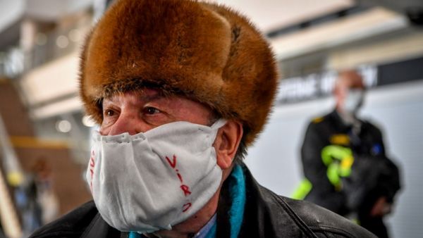 People gather at Moscow's Sheremetyevo airport terminal F for a repatriation flight to France for French and European nationals stuck in Russia because of the coronavirus crisis, April 4, 2020. Yuri KADOBNOV / AFP