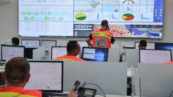 Employees of the COVID-19 coronavirus disease operations room of the Saudi Red Crescent (SRC) are seen while on duty in the Saudi capital Riyadh, on April 6, 2020. The SRC increased their employees to meet the increased demand on ambulances since the novel coronavirus appeared and the kingdom imposed a curfew. FAYEZ NURELDINE / AFP