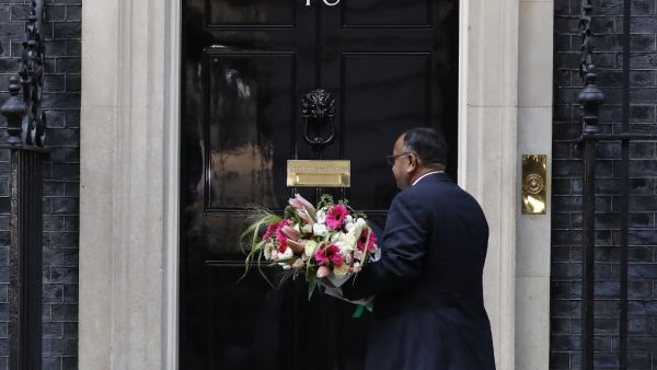Flowers from the Pakistan embassy are delivered to 10 Downing Street in central London, on April 7, 2020 as Britain's Prime Minister Boris Johnson spent the nightin intensive care at St Thomas' Hospital with symptons of the novel coronavirus COVID-19. British Prime Minister Boris Johnson spent the night in intensive care after being admitted with a deteriorating case of coronavirus, prompting serious concerns on Tuesday about his health and the government's response to a still-escalating outbreak. Tolga AKM