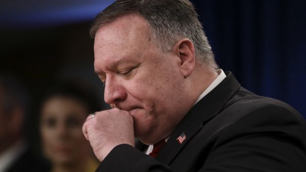 US Secretary of State Mike Pompeo clears his throat as he addresses a news conference at the State Department in Washington,DC on April 7, 2020. LEAH MILLIS / POOL / AFP
