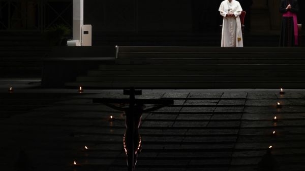 Pope Francis presides over Good Friday's Way of the Cross (Via Crucis) at St. Peter's Square in The Vatican on April 10, 2020 during the lockdown aimed at curbing the spread of the COVID-19 infection, caused by the novel coronavirus. Vincenzo PINTO / AFP