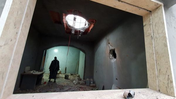 A Libyan man stands at the site of shelling on the residential area of Arada in the capital Tripoli on April 14, 2020. The forces of Libyan military strongman Khalifa Haftar rained rockets on Tripoli today after being ousted by government loyalists from a string of strategic towns west of the capital. The capture yesterday of the coastal towns of Sorman and Sabratha and smaller settlements further south was seen as a major blow to Haftar, who in April last year launched an offensive to seize Tripoli.  Mahmu