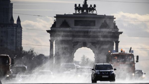 Municipal vehicles clean and disinfect a street in downtown Moscow on April 23, 2020, during the COVID-19 outbreak, caused by the novel coronavirus. Alexander NEMENOV / AFP