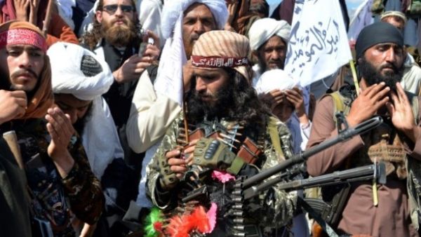 Afghan Taliban fighters and villagers attend a gathering in Alingar district of Laghman Province on the day the militants said they were resuming operations against Afghan government targets File photo AFP