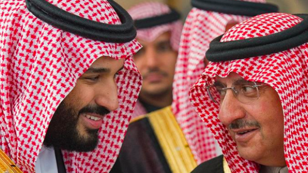 A file photo showing Mohammed bin Salman (L) and Mohammed bin Nayef (R) [Bandar al-Jaloud/Saudi Royal Palace/AFP]