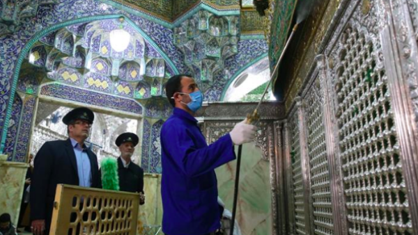 Iranian sanitary workers disinfect Qom''s Masumeh shrine to prevent the spread of the coronavirus [Mehdi Marizad/Fars News/AFP]