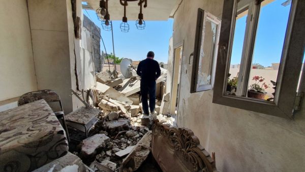 A resident walks amidst the rubble of a building that was damaged when forces loyal to eastern-based strongman Khalifa Haftar shelled the residential neighbourhood of Znatah in the Libyan capital Tripoli, held by the UN-recognised Government of National Accord (GNA), on May 1, 2020. AFP