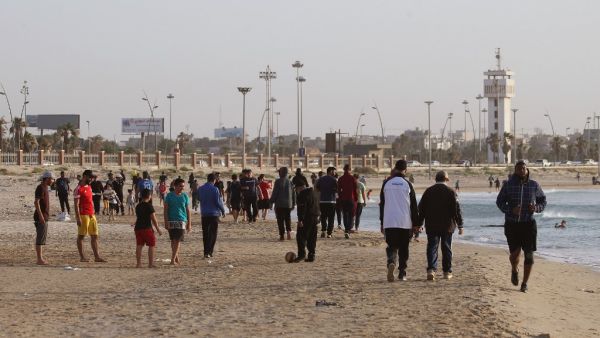 Libyans exercise at the beach before "iftar", or breaking the fast at sunset, during the Muslim holy month of Ramadan in the capital Tripoli, despite a lockdown due to the COVID-19 pandemic, on May 8, 2020. Mahmud TURKIA / AFP