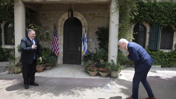 US Secretary of State Mike Pompeo (L), meets with Israeli Blue and White party leader Benny Gantz, in Jerusalem, on May 13, 2020. Pompeo visited Israel for talks with leaders on plans to annex swathes of the occupied West Bank, which has been rocked by two days of deadly violence. The visit by US President Donald Trump's top diplomat comes a day before Netanyahu's unity government with rival-turned ally Benny Gantz was to be sworn in, ending a year of political paralysis.   Sebastian Scheiner / POOL / AFP