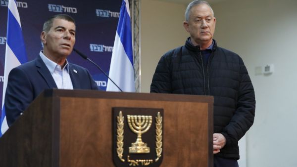 In this file photo taken on February 24, 2020, leader of Israel's Blue and White electoral alliance Benny Gantz (R) listens to Gabi Ashkenazi (L), member of the Blue and White electoral alliance, as he speaks during a press conference in the southern Israeli town of Sderot on the border with Gaza. Former Israeli army chief Gabi Ashkenazi, who spent nearly four decades in the military, will be nominated as Israel's next foreign minister, his Blue and White political alliance said on May 13. Jack GUEZ / AFP